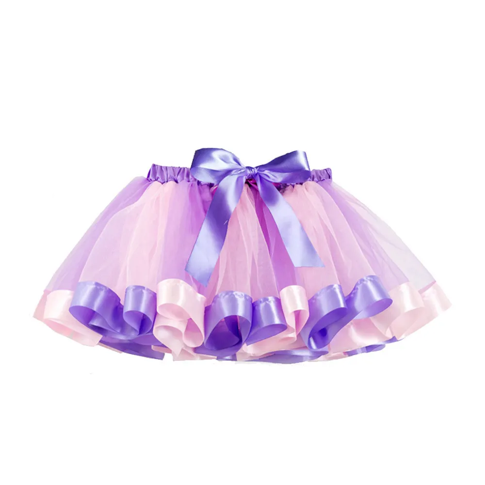 TT013 تنورة قصيرة للفتيات باللون الكحلي مع أقواس تنورة أميرة الأطفال من القماش الصناعي شبكة من الساتان تنورة قصيرة للبيع بالجملة