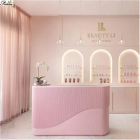 Comptoir de caisse de salon de coiffure de petite taille au design moderne / table de réception rose