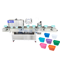 Machine automatique de pressage et de capsulage de couvercle de récipient en plastique de capsule de détergent de blanchisserie à grande vitesse