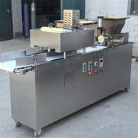 Machine électrique automatique Jiayang pour diviser et arrondir la pâte, idéale pour la découpe de pâte à pain, à pizza et à biscuits faits à partir de farine.