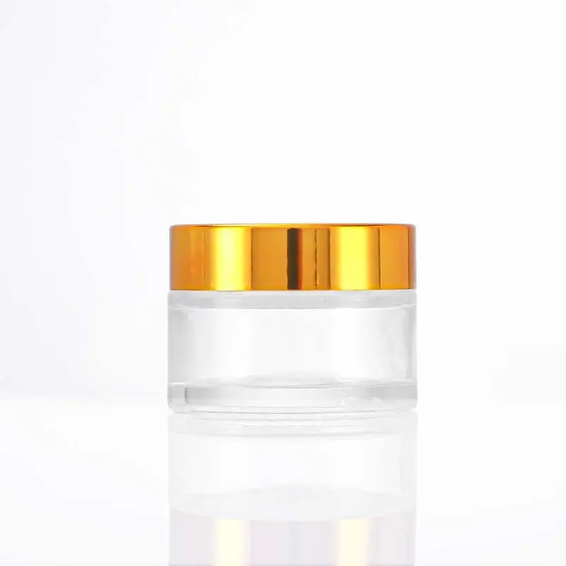 Nuevos productos tarros de crema de vidrio baratos para el cuidado de la piel tarro de vidrio transparente de 2 oz con tapa