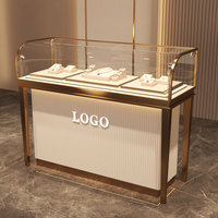 Vitrine à bijoux rotative de luxe, détachable, avec éclairage LED, construction en métal et verre, pour comptoir de bijouterie moderne