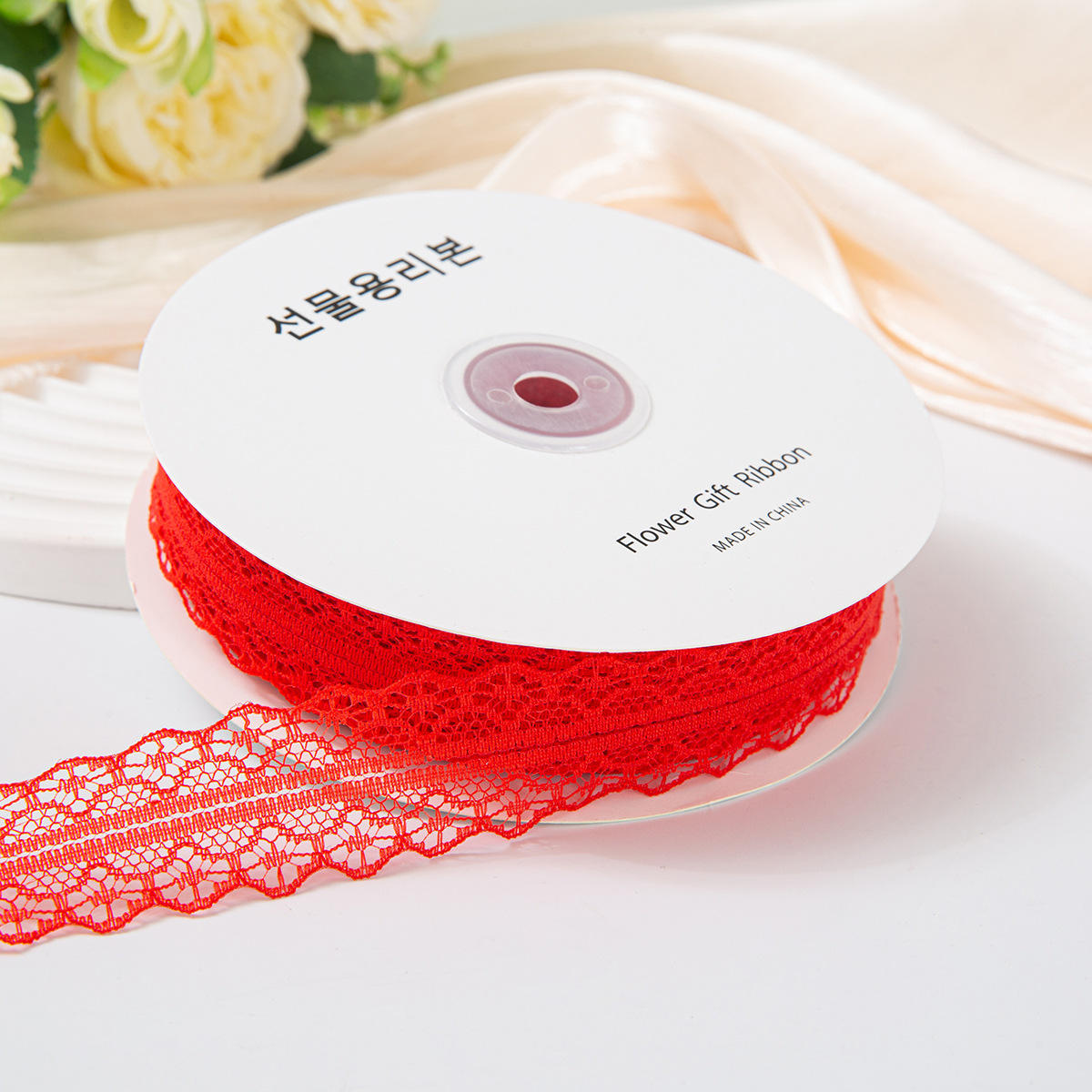 เข็มขัดลูกไม้สีแดง 3 ซม. 50 หลา