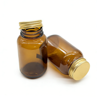 Bouteille en verre ambré avec bouchon à vis en aluminium et couvercles métalliques pour comprimés et capsules, avec scellage par induction thermique – Approvisionnement direct usine