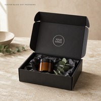 Boîte d'expédition en carton ondulé noir mat avec estampage à chaud argenté personnalisé pour l'expédition de cadeaux de soins de la peau biologiques, auto-scellante, vente en gros