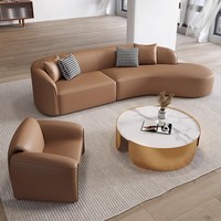 Ensemble de canapés en cuir italien moderne avec design arqué pour hall d'hôtel, comprenant canapé, chaise et table, pour mobilier de réception de salon