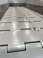 Équipement de transport de carrière Composants de base Moteur à engrenages à roulement Moteur Convoyeur minéral Chaîne Plaque d'alimentation pour machine minière