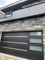 Porte de garage isolée en acier sur mesure avec fenêtres et accessoires