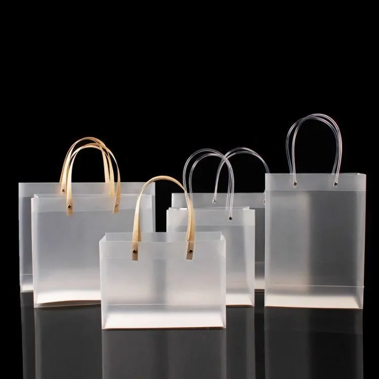 Bolsa de regalo transparente con logotipo personalizado, embalaje de ropa de zapatos, bolso de mano de vinilo transparente de PVC