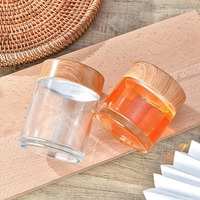 Pot à miel rond en verre transparent de qualité supérieure avec impression de logo personnalisé et emballage élégant en boîte cadeau pour les marques gastronomiques