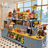 Comptoir d'exposition incurvé lumineux à LED, personnalisable (bleu/jaune), éco-responsable, avec dessus en bois et étagères pour magasin de jouets pour enfants