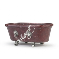 Baignoire ovale autoportante en marbre rouge veiné avec pieds en forme de tête de lion et pieds argentés pour maison et hôtel
