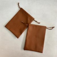 Pochette à cordon en cuir PU avec logo personnalisé en relief, sac de voyage en cuir de luxe pour cosmétiques, emballage pour maquillage, parfum, bijoux