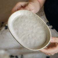 Assiette de table en céramique pour hôtel, ovale, en grès moucheté, blanc crème, 6,5 pouces, vaisselle de restaurant, vente en gros pour la restauration des centres de villégiature