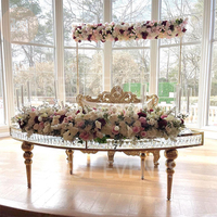 Table de salle à manger serpentine en cristal en forme de S avec pieds en acier inoxydable et plateau en verre pour mariage