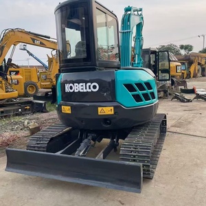 Mini-excavatrice Kobelco d'occasion, équipement de construction sur chenilles, couleur bleu-noir - Product Image 1