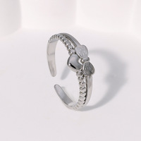 Bague ouverte hypoallergénique en acier inoxydable pour femme, motif nœud d'amour simple et minimaliste, ne ternit pas, mignonne et élégante, vente en gros