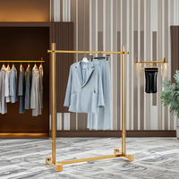 Table et étagères de présentation de vêtements pliables en acier inoxydable doré brillant CAIYI XG19 au design moderne