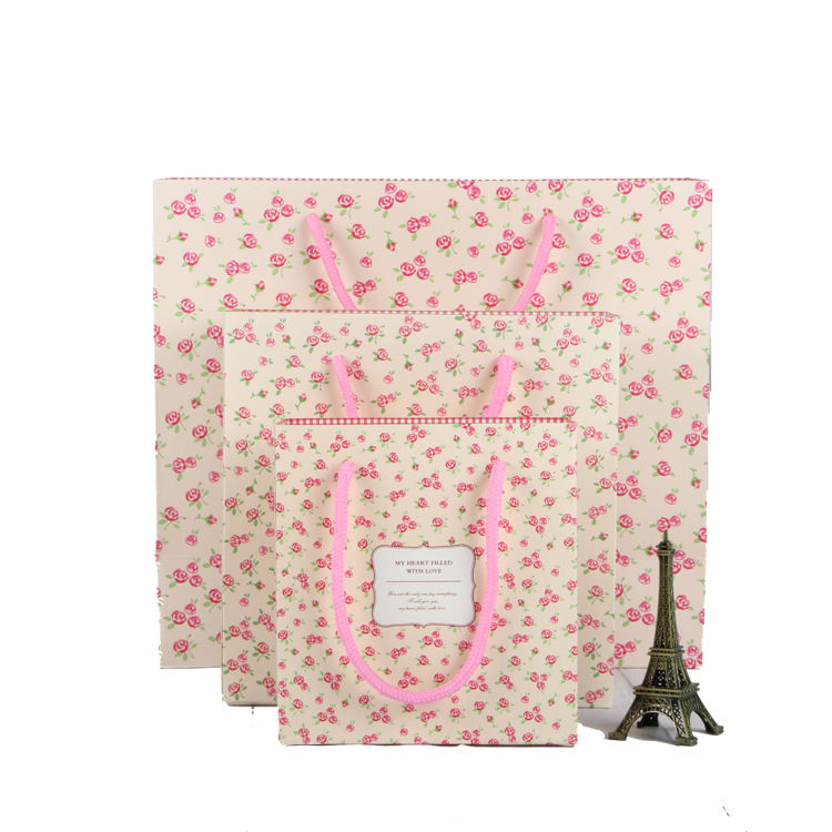Pink eco friendly luxury paper packing bag for gift jewelry with ribbon handle