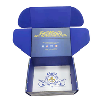 Boîte-cadeau de luxe bleu profond avec lignes géométriques argentées et plateau intérieur en relief pour les produits de santé de thé de qualité supérieure