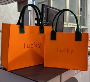 Sacs promotionnels de sacs en feutre de couleur orange écologique de logo personnalisé pour faire du shopping - Product Image 1