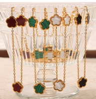 Parure de bijoux à la mode Collier en acier inoxydable plaqué or 18 carats Bracelet en coquillage avec fleur en nacre Boucles d'oreilles pour femmes