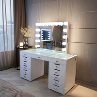 Coiffeuse de luxe européenne en bois, best-seller, avec miroir éclairé et lumières LED réglables, et tabouret