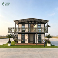 Casa Móvil Económica Expandible y Plegable de Acero con Techo a Dos Aguas, Balcón y Escalera Exterior, Casa Pequeña de 20 Pies y 2 Pisos