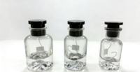 Flacon de parfum en verre rond OEM personnalisé en gros, base volcanique, transparent, or, rouge, vert, blanc, argent, 30 ml, 50 ml, 100 ml, avec boîte