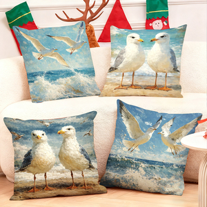 Des coussins décoratifs sur le thème des mouettes ornent un canapé confortable avec des chaussettes de Noël festives en arrière-plan. - Product Image 1