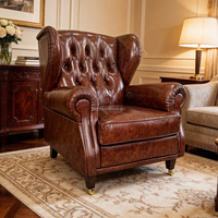 Fauteuil Chesterfield classique en cuir véritable marron capitonné avec dossier haut pour bar à domicile et salon de cigares