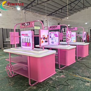 <span class=keywords><strong>Kiosque</strong></span> mobile personnalisé rose pour vernis à ongles avec éclairage LED, idéal pour les événements en centre commercial et la promotion de marques de beauté et d'art des ongles - Product Image 1