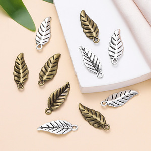 Colgante de hoja de aleación de zinc de 9,5x24,5mm para fabricación de joyas, accesorios DIY, amuleto unisex con forma de planta - Product Image 1