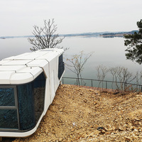 Futur hôtel flottant de luxe maison conteneur fab petite maison en verre sur roues avec toboggan mur péniche