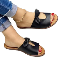 Sandales plates surdimensionnées pour femmes avec nœud décoratif et design ajouré respirant