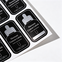 Étiquettes autocollantes en PET noir avec gaufrage argenté pour flacons compte-gouttes d'huile pour le visage Haoxuan OEM, pour emballages cosmétiques