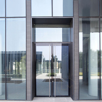 Porte d'entrée double moderne sur mesure en verre et aluminium pour commerce extérieur