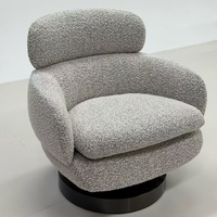Fauteuil pivotant moderne en bouclette - Design italien, fauteuil lounge rond avec base en métal pour salon de luxe et hall d'hôtel