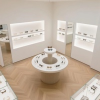 Présentoir Optique Moderne Blanc Courbé de Luxe avec Éclairage LED, Vitrine à Lunettes à Niveaux pour Magasin de Détail et Showroom