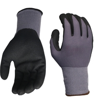 Gants de travail de sécurité en nylon gris sans couture de calibre 15 mélangé à du spandex avec revêtement en nitrile sable noir sur la paume