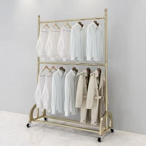 Porte-vêtements mobile à double rail avec roulettes pour les tenues des enfants et des femmes dans les boutiques - Product Image 4