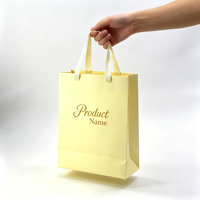 Vente en gros d'usine, sacs en papier kraft personnalisés de luxe, sacs cadeaux artisanaux jaunes, sacs de shopping imprimés avec logo
