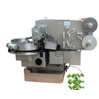 Machine de traitement du chocolat pour l'enrobage automatique des bonbons au chocolat et l'emballage de bonbons à double torsion