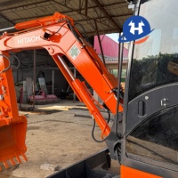 Mini-excavatrice sur chenilles Hitachi ZX65USB-5A d'occasion bien entretenue, modèle 2023, 6,5 tonnes, avec inspection vidéo du moteur, du pompe et des roulements hydrauliques.
