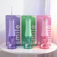 OEM Nouveau Jet d'eau électrique 300ml Meilleur irrigateur buccal dentaire Nouveau modèle en gros IPX7 Jet d'eau pour blanchir les dents Pik Water Flosser