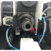 Tour CNC automatique horizontal ST125 à double broche de haute précision avec commande Fanuc, banc plat et prix compétitif