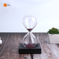 Vente en gros unique cadeau souvenir promotionnel sablier de Noël en bois de verre moderne avec socle magnétique en bois noir