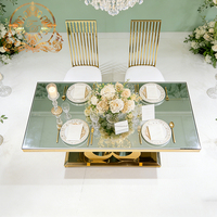 Tables rectangulaires romantiques en acier inoxydable avec base double croisée dorée en forme de cœur et plateau transparent pour hôtels, restaurants et banquets de mariage