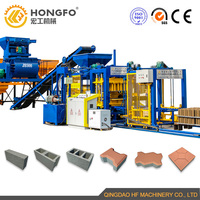 Machines de fabrication de briques à emboîtement hydraulique automatique à moteur QT5-15/ciment Machine de fabrication de blocs de béton creux Pierre concassée