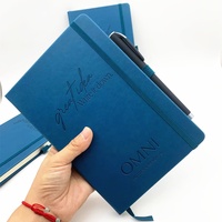 Carnet de type Moleskine A5, couverture en cuir PU bleu, équipé d'un élastique et d'un porte-stylo pour un usage quotidien